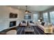 Inviting living room with a cozy fireplace, stylish decor, and ample seating at 1927 Rannoch Dr, Longmont, CO 80504