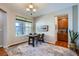 Bright dining room with a table for four and a large window at 2272 Front Range Rd, Erie, CO 80516
