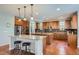 Spacious kitchen with two islands, stainless steel appliances, and wood cabinets at 2272 Front Range Rd, Erie, CO 80516