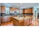 Beautiful kitchen featuring granite countertops, wood cabinets, and stainless steel appliances at 2272 Front Range Rd, Erie, CO 80516