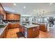 Open kitchen layout with granite countertops, stainless steel appliances, and center island at 2272 Front Range Rd, Erie, CO 80516
