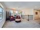 Upstairs loft area with cozy seating and decorative accents, providing a relaxed atmosphere at 2272 Front Range Rd, Erie, CO 80516
