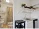 Updated bathroom featuring new sink, granite countertop, and modern shower with glass door at 1680 Syracuse St, Denver, CO 80220