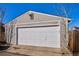 A well-maintained garage features a white door and the house number 1680 displayed above at 1680 Syracuse St, Denver, CO 80220