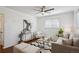 Cozy living room featuring a ceiling fan, hardwood floors and bright white walls that create a relaxing atmosphere at 1680 Syracuse St, Denver, CO 80220