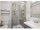 Modern bathroom featuring glass enclosed shower stall with multiple shelves and modern fixtures at 1680 Syracuse St, Denver, CO 80220