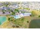 Aerial shot of community pool with splashpad, park, lake, and clubhouse; a vibrant neighborhood hub at 18173 E 104Th Way, Commerce City, CO 80022