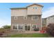 Well-maintained backyard with a paver patio, lush lawn, privacy fence, and mature landscaping at 18173 E 104Th Way, Commerce City, CO 80022