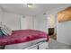 Bright bedroom featuring an ensuite bathroom and ample natural light at 18173 E 104Th Way, Commerce City, CO 80022