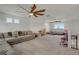 Large bonus room perfect for play, featuring multiple ceiling fans and lots of natural light at 18173 E 104Th Way, Commerce City, CO 80022