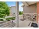 Inviting front porch features stone accents, cozy seating, and attractive landscaping elements at 18173 E 104Th Way, Commerce City, CO 80022