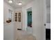 Hallway leading to the bathroom and bedroom, featuring a stylish built-in bookcase at 18173 E 104Th Way, Commerce City, CO 80022