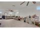 Open-concept living room featuring a large sectional and play area at 18173 E 104Th Way, Commerce City, CO 80022