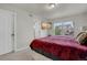 Comfortable main bedroom with bright windows, plush bedding, and neutral wall color at 18173 E 104Th Way, Commerce City, CO 80022