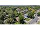 Aerial view of the neighborhood featuring tree-lined streets and a community pool at 6240 W 110Th Pl, Westminster, CO 80020