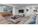 Spacious finished basement with a pool table, cozy seating, and a large TV at 6240 W 110Th Pl, Westminster, CO 80020