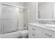 Well-lit bathroom with a bathtub, shower, and vanity with marble countertop at 6240 W 110Th Pl, Westminster, CO 80020