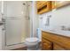 Traditional bathroom featuring a glass shower, wood vanity and plenty of light at 6240 W 110Th Pl, Westminster, CO 80020