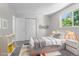 Serene bedroom featuring a modern design, ample natural light, and a comfortable bed at 6240 W 110Th Pl, Westminster, CO 80020