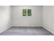 Serene bedroom with a large window offering a view of lush greenery at 6240 W 110Th Pl, Westminster, CO 80020
