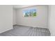 Bright bedroom with neutral carpet, window, and closet at 6240 W 110Th Pl, Westminster, CO 80020