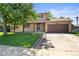 Charming two-story home with a well-maintained lawn and attached two car garage at 6240 W 110Th Pl, Westminster, CO 80020
