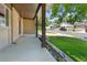 Charming covered front porch with brick accents and landscaped flower beds at 6240 W 110Th Pl, Westminster, CO 80020