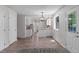 Updated kitchen with white cabinets, stainless appliances, and wood flooring at 6240 W 110Th Pl, Westminster, CO 80020