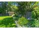 Landscaped yard with decorative flower bed and lawn at 6240 W 110Th Pl, Westminster, CO 80020