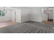 Open living room with neutral walls, new carpet, and updated staircase at 6240 W 110Th Pl, Westminster, CO 80020