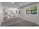Bright living room with backyard views leading to kitchen and dining at 6240 W 110Th Pl, Westminster, CO 80020