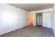 Bright bedroom with carpet, closet, and adjoining bathroom at 8798 Chase Dr # 2, Arvada, CO 80003