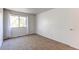 Sunlit bedroom features a window, carpet, and ample space at 8798 Chase Dr # 2, Arvada, CO 80003