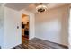 Dining room featuring wood floors, a modern ceiling fan, and an open view to the kitchen at 8798 Chase Dr # 2, Arvada, CO 80003