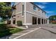 A charming exterior view with an attached garage with parking spots, a manicured lawn, and an exterior balcony at 8798 Chase Dr # 2, Arvada, CO 80003