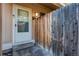 Close-up of a townhome front door and fence, creating a sense of privacy and security at 8798 Chase Dr # 2, Arvada, CO 80003