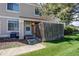 Charming townhome entrance featuring a quaint fenced front yard and well-maintained landscaping at 8798 Chase Dr # 2, Arvada, CO 80003