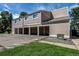 Townhome exterior showcasing garages and landscaping, offering convenience and curb appeal at 8798 Chase Dr # 2, Arvada, CO 80003