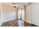 Cozy living room with hardwood floors, sliding glass door, and neutral decor at 8798 Chase Dr # 2, Arvada, CO 80003