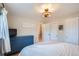 Charming bedroom boasting a queen-sized bed, blue dresser, and ample closet space at 6970 Upham St, Arvada, CO 80003