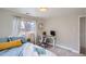 Cozy bedroom with soft lighting, a comfortable bed, and a functional desk area, ideal for work or study at 6970 Upham St, Arvada, CO 80003