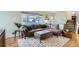 Cozy living room featuring a comfortable sectional sofa and large window at 6970 Upham St, Arvada, CO 80003
