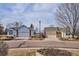 Two-house view from the street, showcasing attached garages at 9748 W Peakview Dr, Littleton, CO 80123