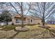 Landscaped backyard with stone planters and a deck at 9748 W Peakview Dr, Littleton, CO 80123