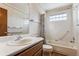 Clean bathroom with single sink vanity, shower/tub combo, and grab bars at 9748 W Peakview Dr, Littleton, CO 80123