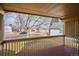 Covered deck overlooking the backyard and neighborhood at 9748 W Peakview Dr, Littleton, CO 80123