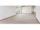 Empty dining room with carpeted floor and large window at 9748 W Peakview Dr, Littleton, CO 80123