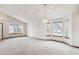 Bright dining room with bay window and chandelier at 9748 W Peakview Dr, Littleton, CO 80123