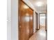 Hallway with wood flooring and double sliding doors to closet at 9748 W Peakview Dr, Littleton, CO 80123