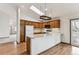 Bright kitchen features wood cabinets and an island at 9748 W Peakview Dr, Littleton, CO 80123